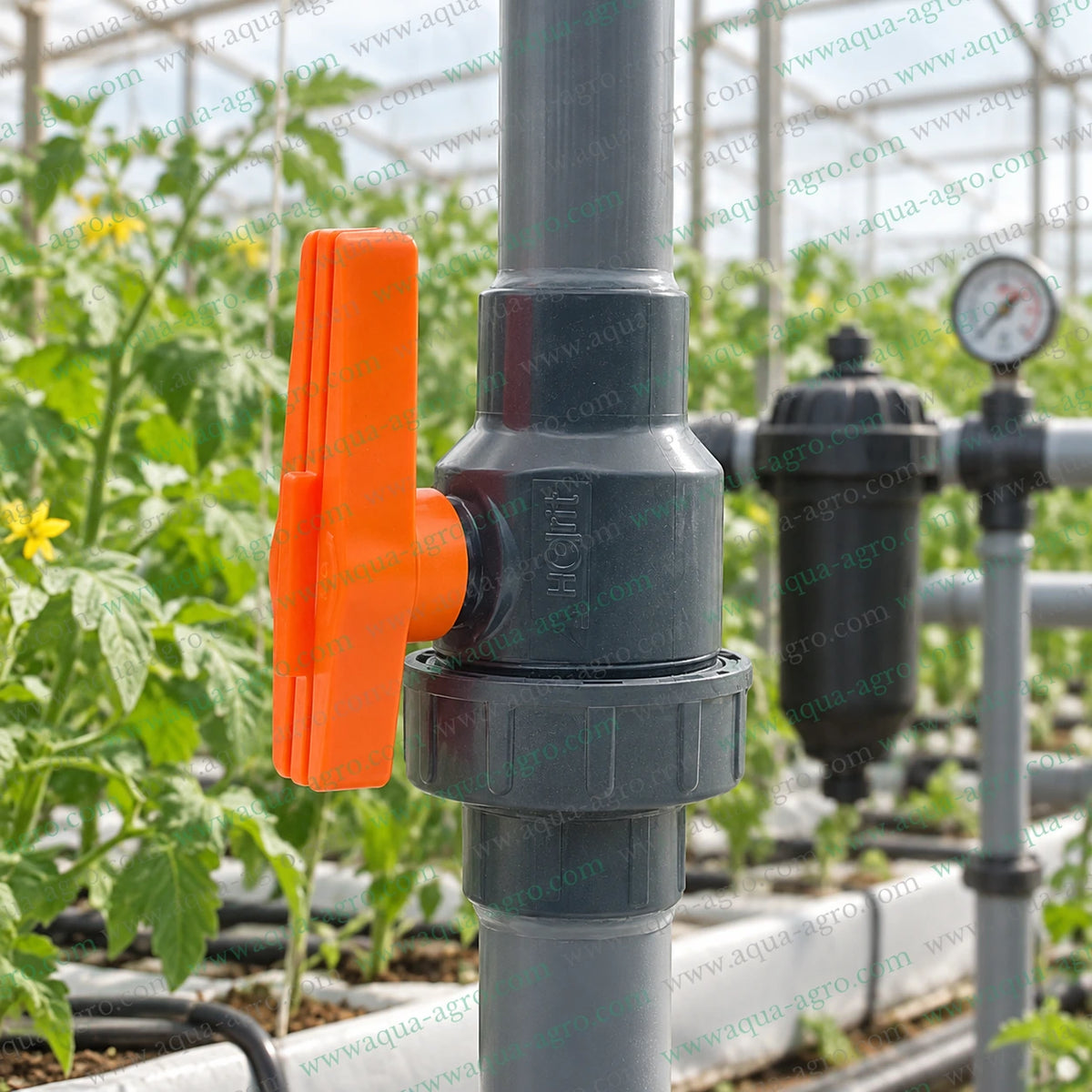 AUTOMAT Harit 1.25 inch (40mm) PVC single union ball valve installed in a greenhouse irrigation pipeline for agricultural water flow control, irrigation systems and farm water management