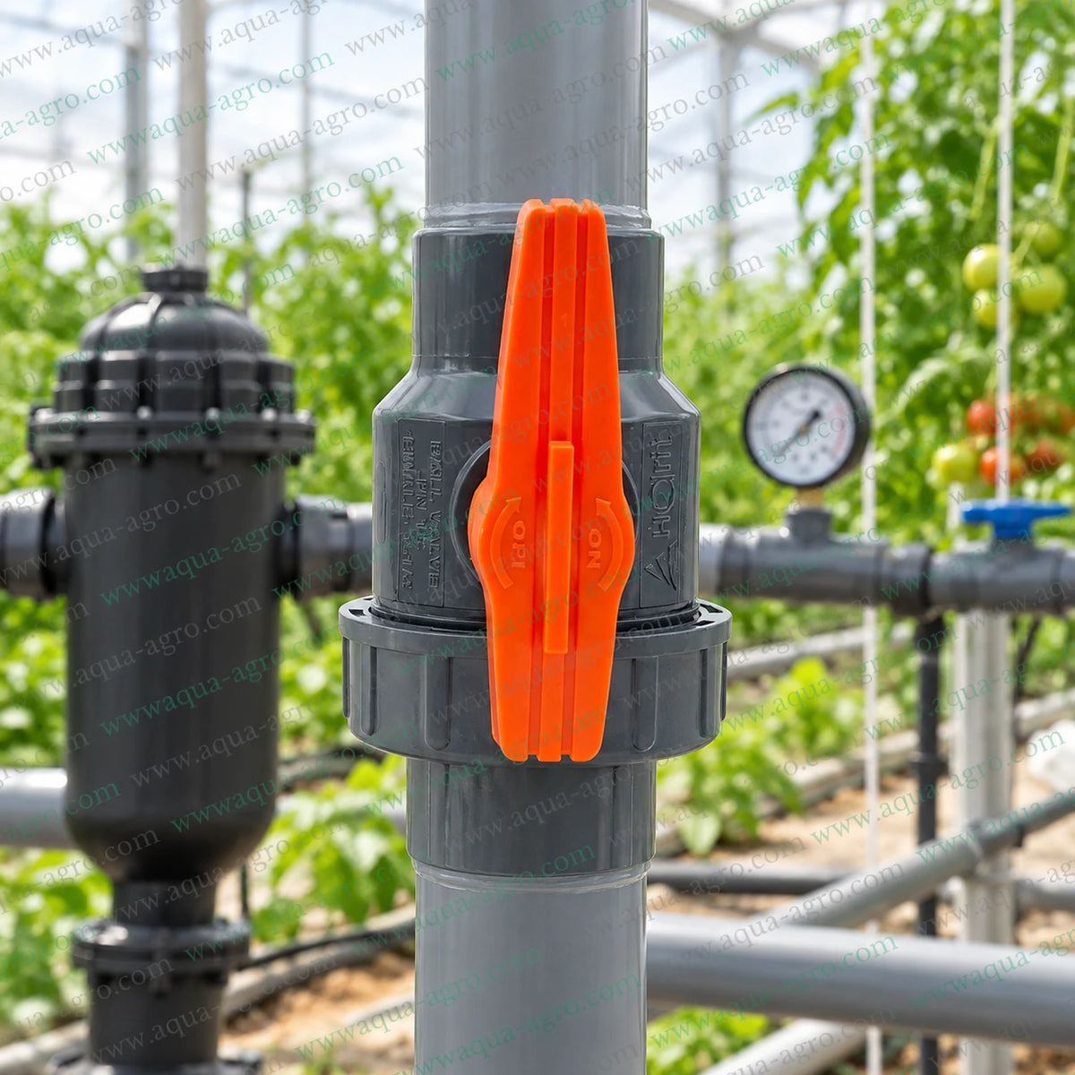 AUTOMAT Harit 1.5 inch (50mm) PVC single union ball valve installed in a greenhouse irrigation pipeline for agricultural irrigation, farm water management and reliable water flow control
