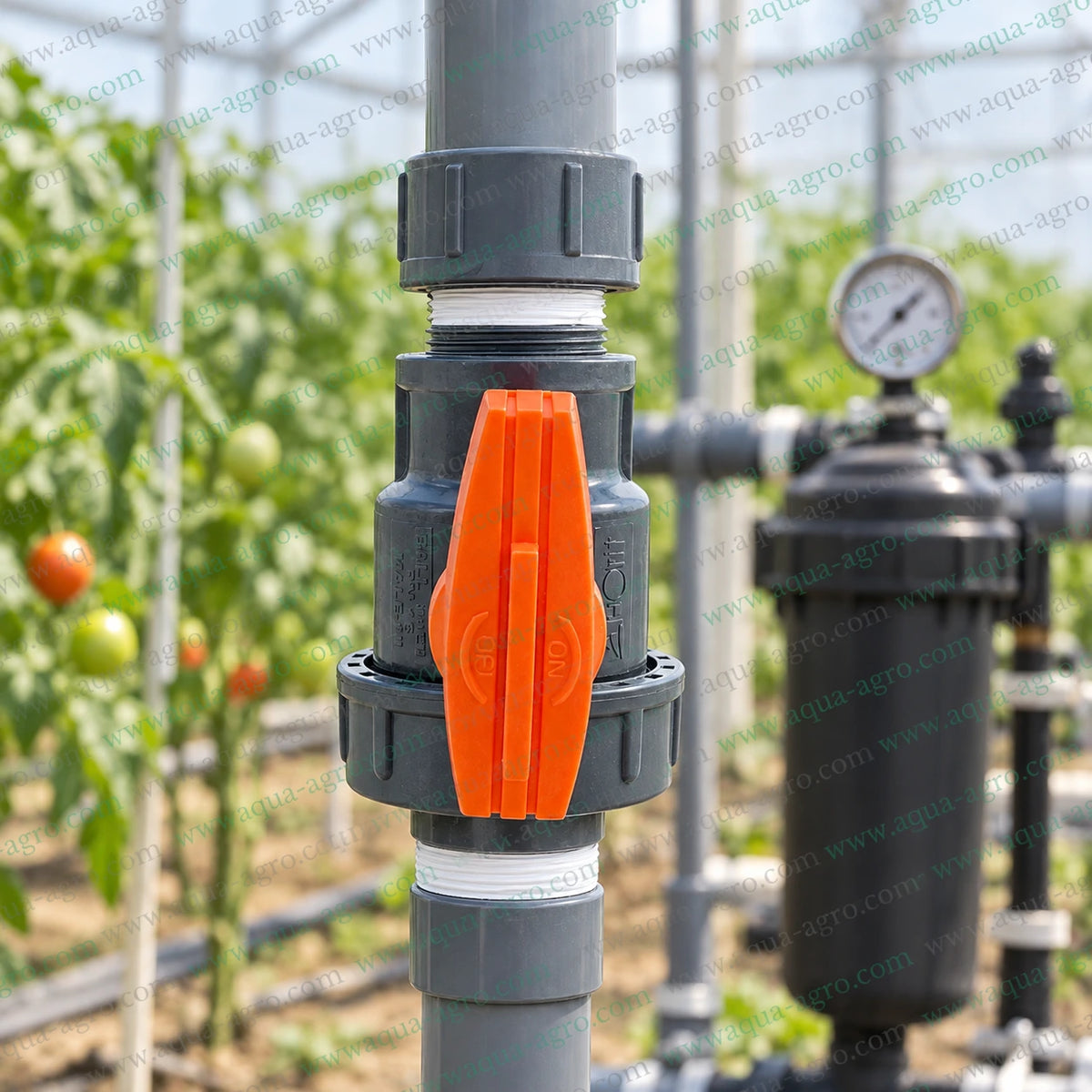 AUTOMAT HT-63-FM-SU 1 inch (32mm) PVC single union ball valve with male and female threaded connections installed on an agricultural greenhouse irrigation pipeline for reliable water flow control