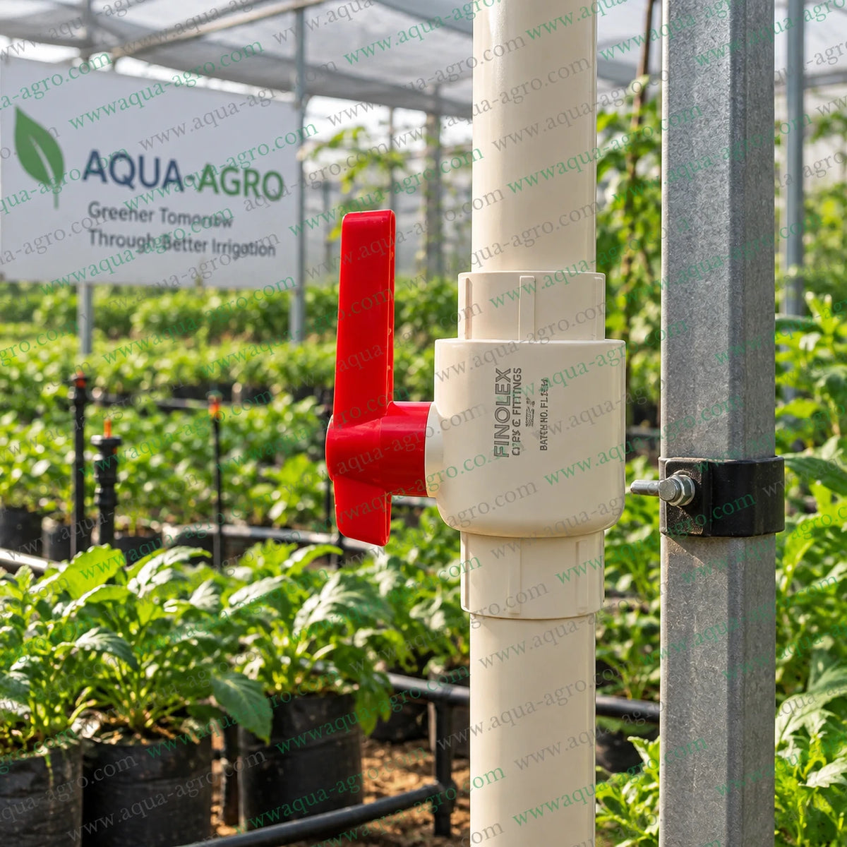 Finolex 2 inch 50mm CPVC moulded ball valve with red lever handle installed on irrigation pipe for agricultural water flow control